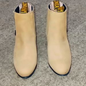 They are men's suede ankle boots of size 6.5 light